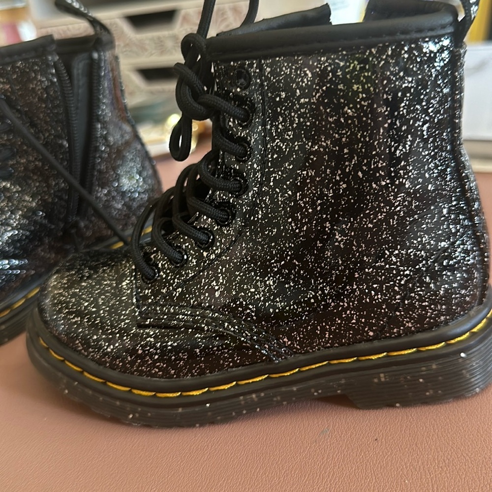 Girls Dr. Marten sparkly black boots .